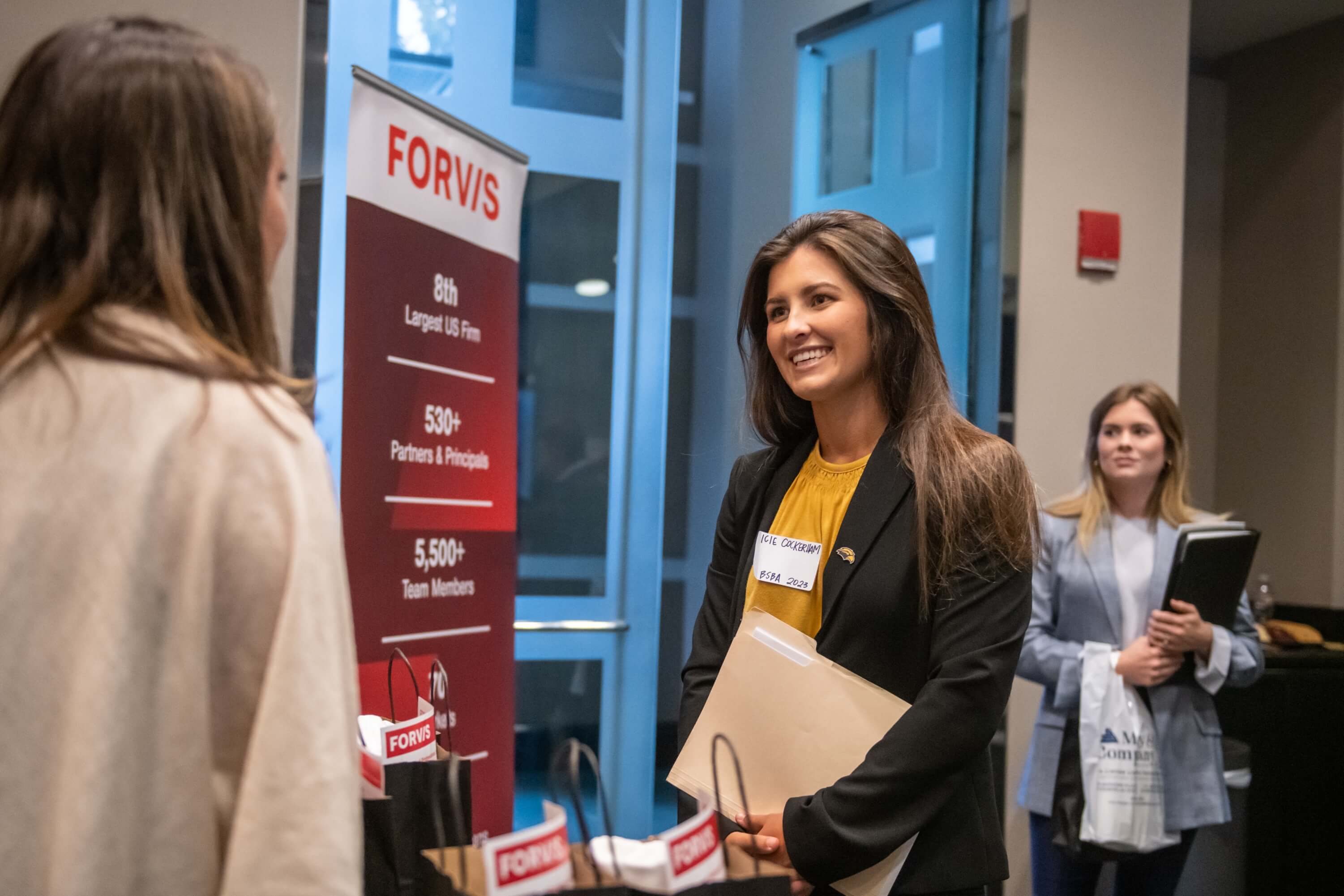 student at recruiting event