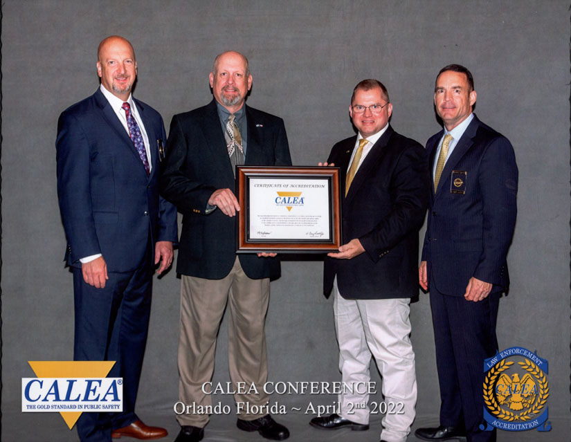 Chief Rusty Keyes and UPD CALEA Manager Sgt. David Byrd receiving the award