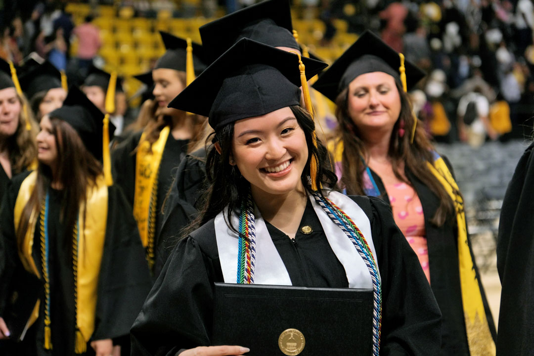 USM student smiles at graduation